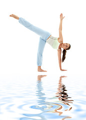 Image showing ardha chandrasana half moon pose on white sand