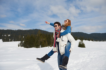 Image showing happy young couple having fun on fresh show on winter vacation