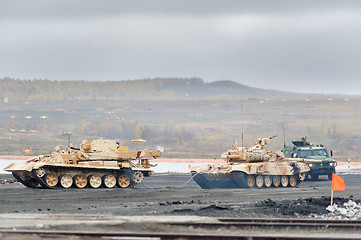 Image showing Armoured recovery vehicle BREM-1M evacuates tank