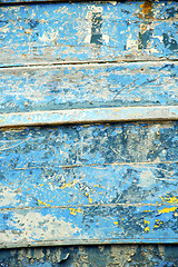 Image showing dirty  paint in the blue  and rusty nail