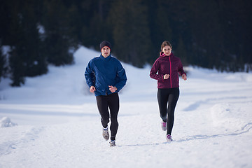 Image showing couple jogging outside on snow