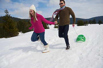 Image showing happy young couple having fun on fresh show on winter vacation