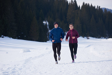 Image showing couple jogging outside on snow