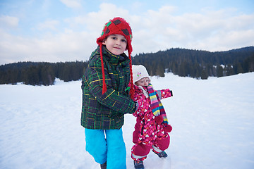 Image showing kids walking on snow
