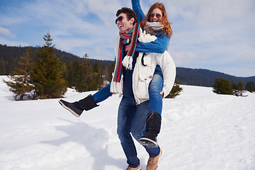 Image showing happy young couple having fun on fresh show on winter vacation