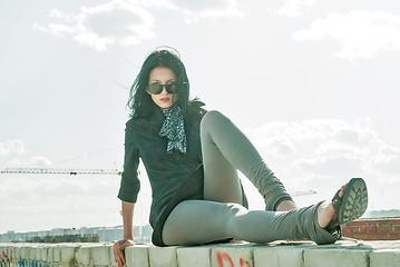 Image showing Young pretty woman on roof