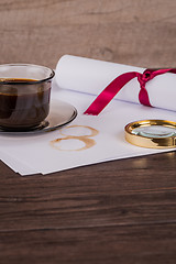 Image showing Coffee cup, paper sheets and detective hat