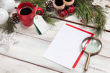 Image showing The blank sheet of paper on the wooden table with a pen 