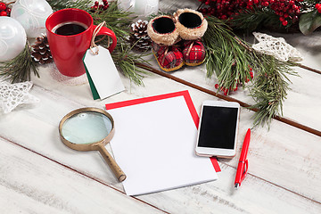 Image showing The blank sheet of paper on the wooden table with a pen 