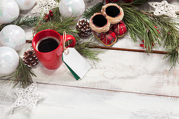 Image showing The a cup of coffee on the wooden table 