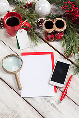 Image showing The blank sheet of paper on the wooden table with a pen 