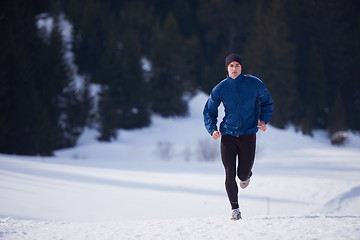 Image showing jogging on snow in forest