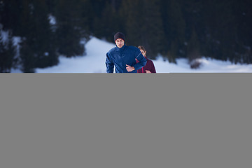 Image showing couple jogging outside on snow