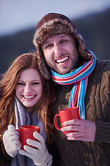 Image showing couple drink warm tea at winter