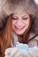 Image showing winter girl with gift