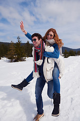 Image showing happy young couple having fun on fresh show on winter vacation