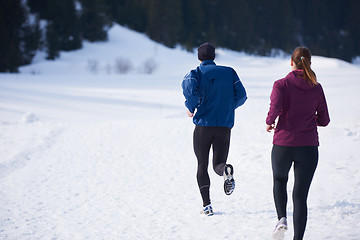 Image showing couple jogging outside on snow