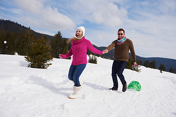 Image showing happy young couple having fun on fresh show on winter vacation