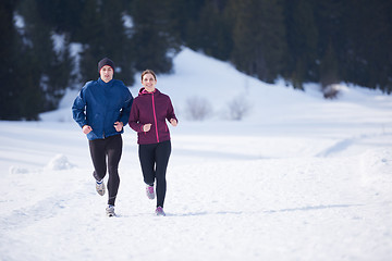 Image showing couple jogging outside on snow