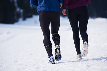 Image showing couple jogging outside on snow