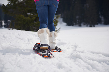 Image showing couple having fun and walking in snow shoes