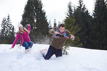 Image showing couple having fun and walking in snow shoes