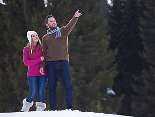 Image showing couple having fun and walking in snow shoes