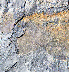 Image showing rocks stone and red orange gneiss in the wall of morocco