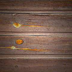 Image showing home texture of a brown antique wooden old door in italy   europ