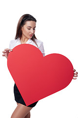 Image showing Woman holding big red heart shape banner