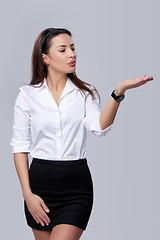 Image showing business woman blowing on palm