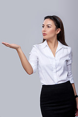 Image showing business woman blowing on palm