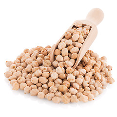 Image showing Uncooked chickpeas and wooden scoop