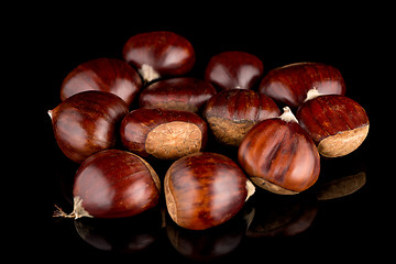 Image showing Chestnuts on a black reflective background