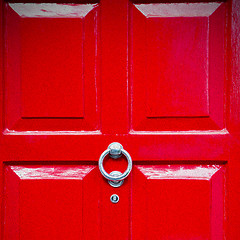 Image showing red handle in london antique brown door  rusty  brass nail and l