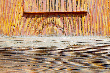 Image showing grain texture of a brown antique wooden old door in italy   euro