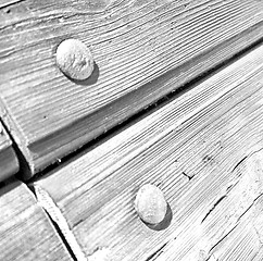 Image showing abstract texture of a brown antique wooden old door in italy   e