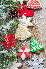 Image showing Fir branches and Christmas decorations and gingerbread.