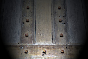 Image showing in london antique brown door  rusty  brass nail and light