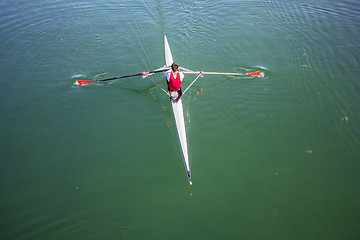 Image showing Young man Rower in a boat