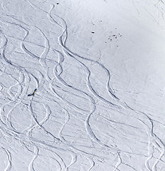 Image showing Snowboarder downhill on off piste slope with newly-fallen snow