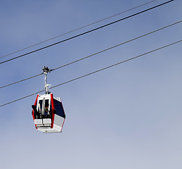 Image showing Gondola lift with ski and snowboards
