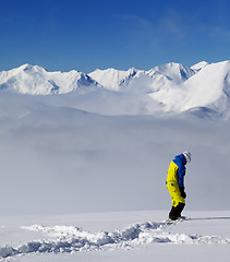 Image showing Snowboarder on off-piste slope with new fallen snow