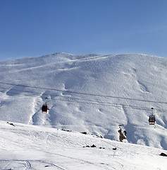 Image showing Gondola lifts and ski slope at nice sun morning