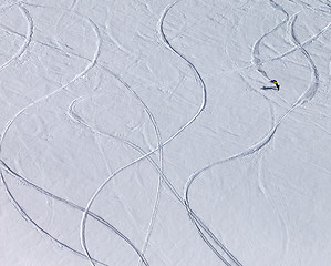 Image showing Snowboarder downhill on off piste slope