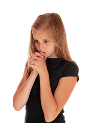 Image showing Girl standing in profile and praying.