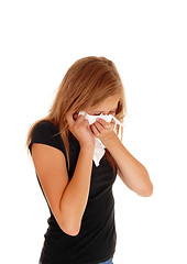 Image showing Little girl blowing her nose.