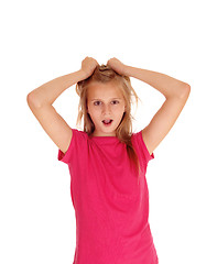 Image showing Pretty blond girl pulling her hair.