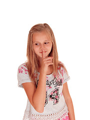 Image showing Young pretty girl with finger over mouth.