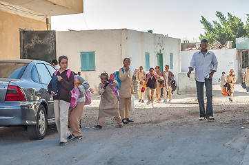 Image showing Pupils come back home from school